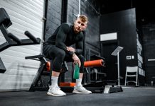 Do You Need to ‘Load’ Creatine? Creatine powder scoop next to supplement shaker