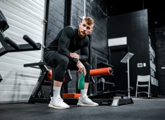 Do You Need to ‘Load’ Creatine? Creatine powder scoop next to supplement shaker